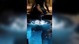 Sonipanda gets her sexy shiny pantyhose wet in a pool