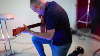 girl posing naked with a guitar (music)